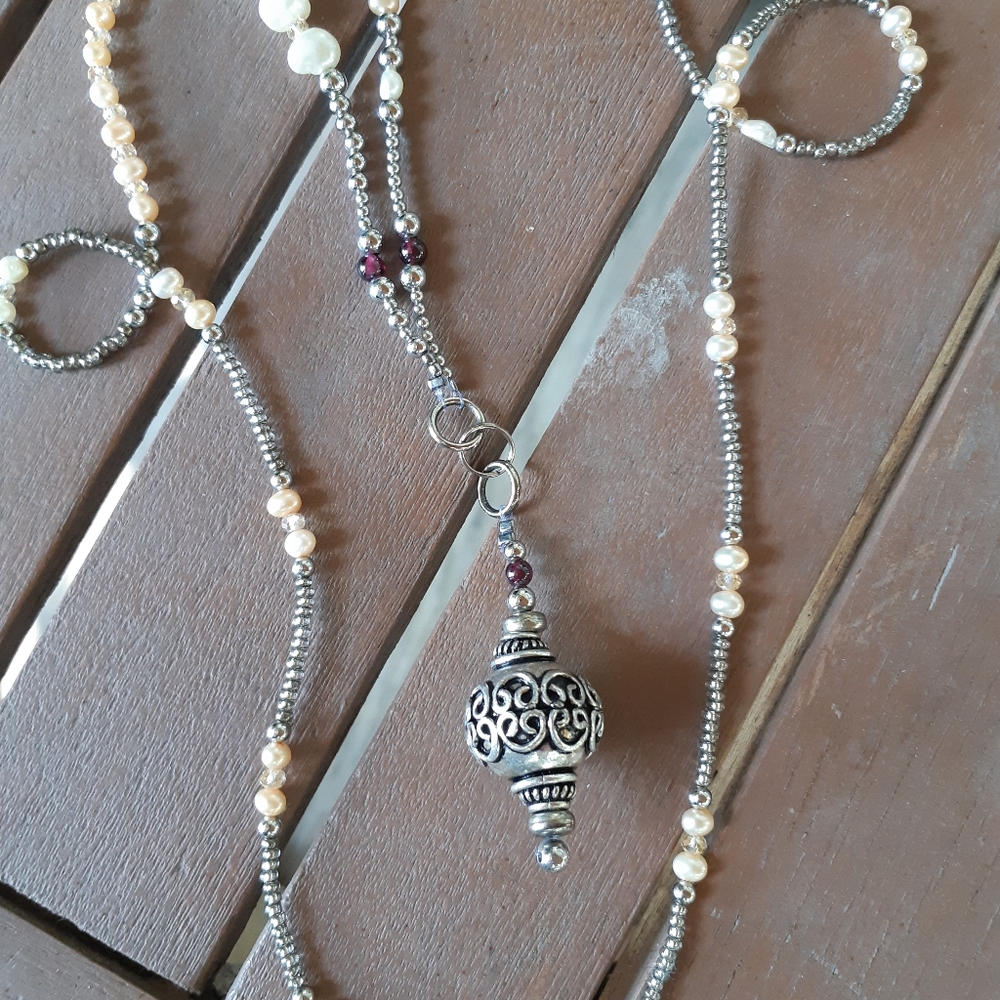 Necklace with pendant.